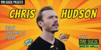 Chris Hudson gazing up and to the right on a background of orange and yellow rays.