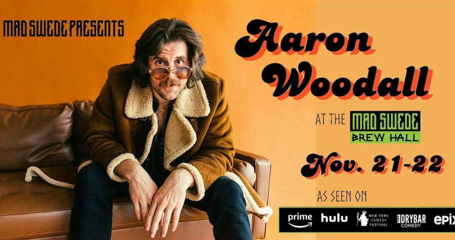 Comedian Aaron Woodall sitting on a couch